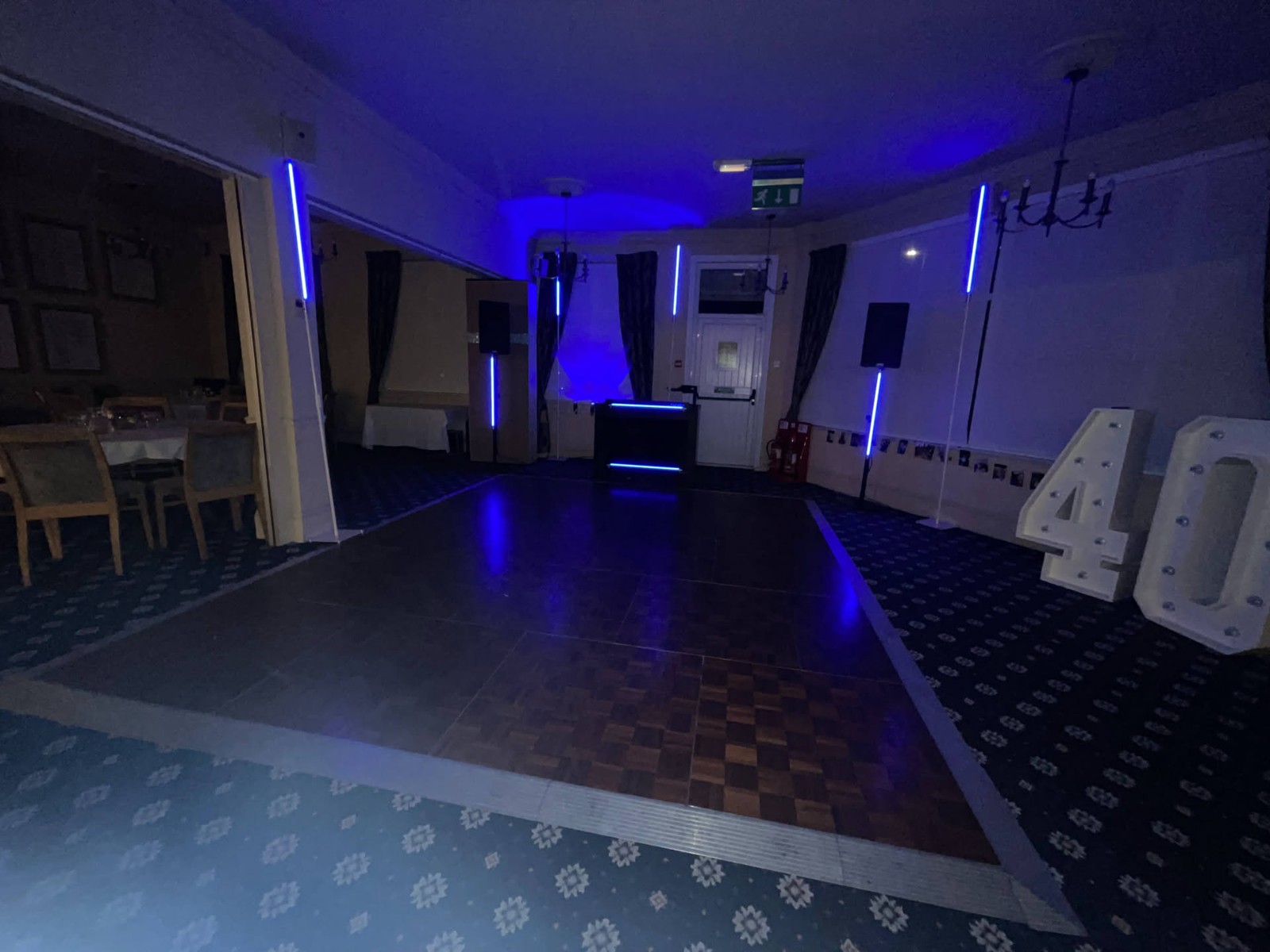 Banstead Downs Golf Club · Black booth and column lighting, ready for a clubhouse birthday celebration