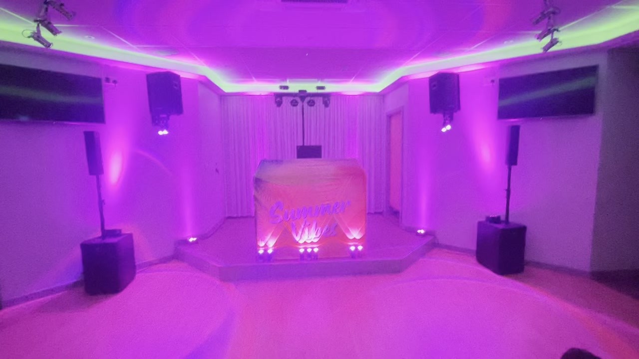 Comrades Club Epsom · A summer party setup with colourful uplighting — video still