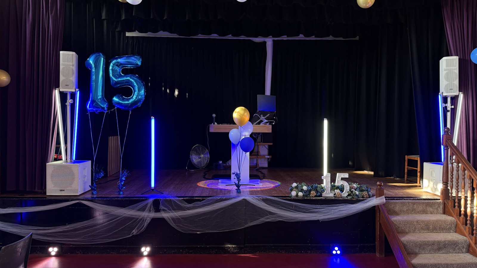 Langley Vale Village Hall · A podium booth and stage lighting, ready for a birthday celebration