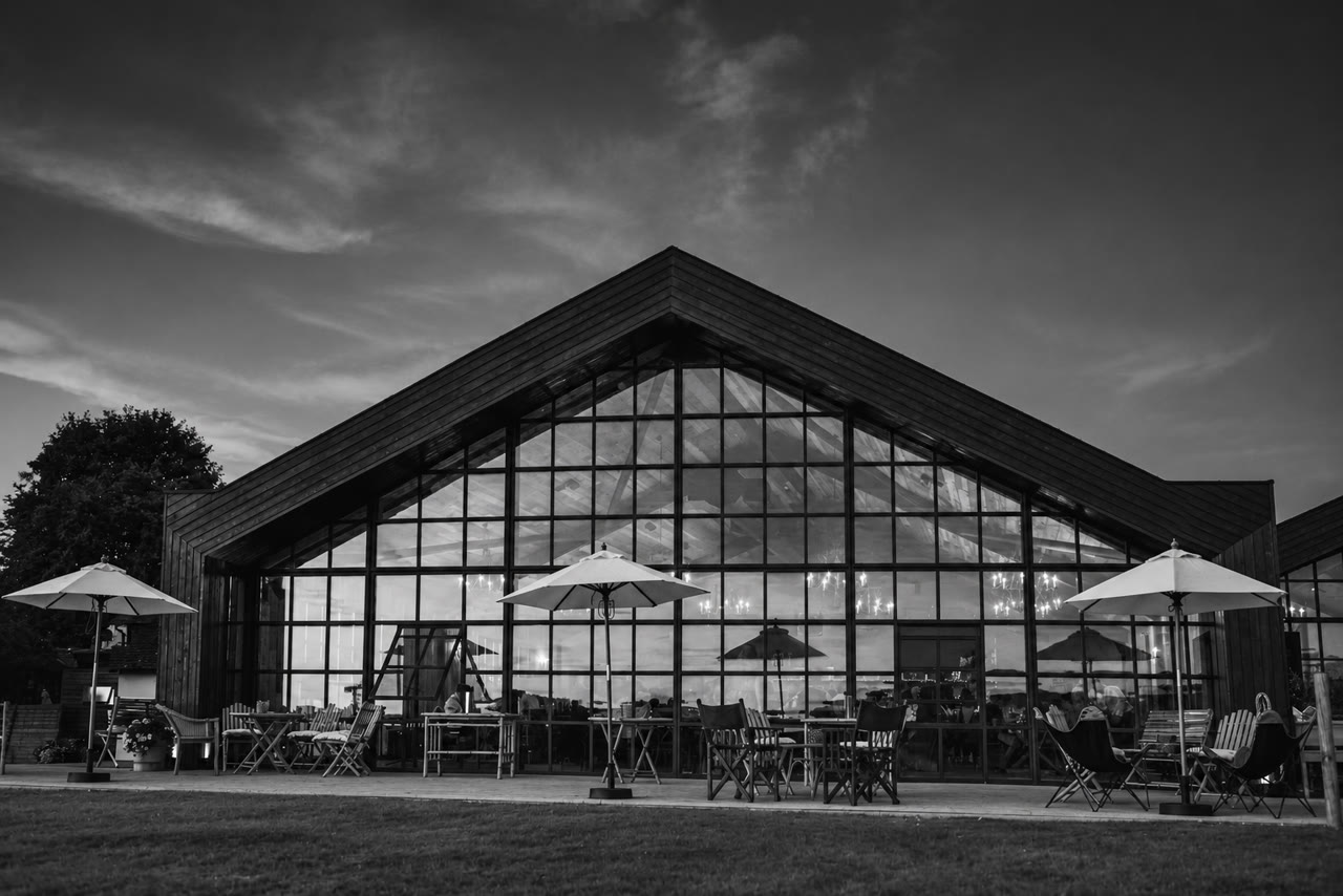 Soft monochrome venue view of The Barn at Botley Hill