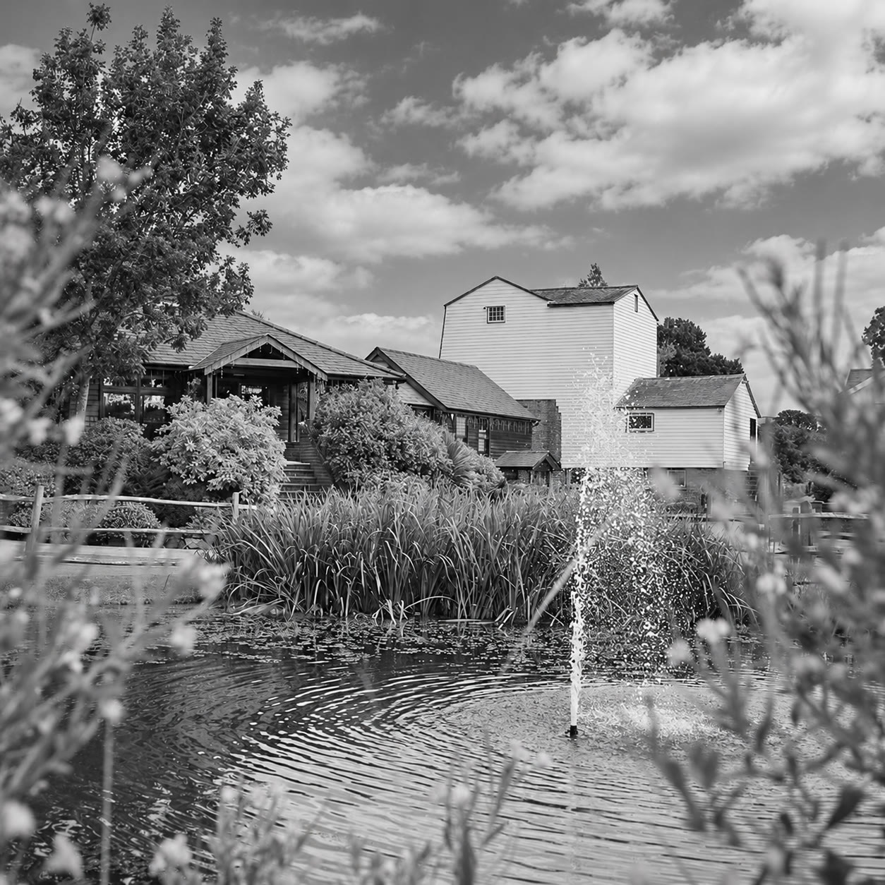 Soft monochrome venue view of Coltsford Mill