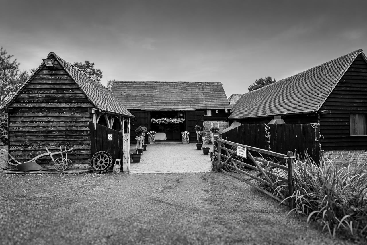 Soft monochrome venue view of Gildings Barns