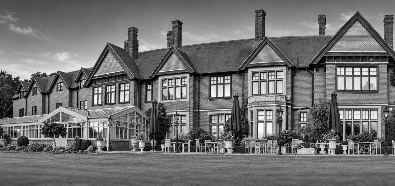 Soft monochrome venue view of Stanhill Court Hotel